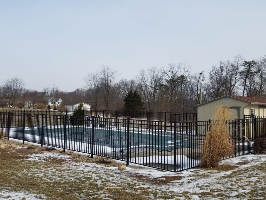 metal security fence around a swimming pool